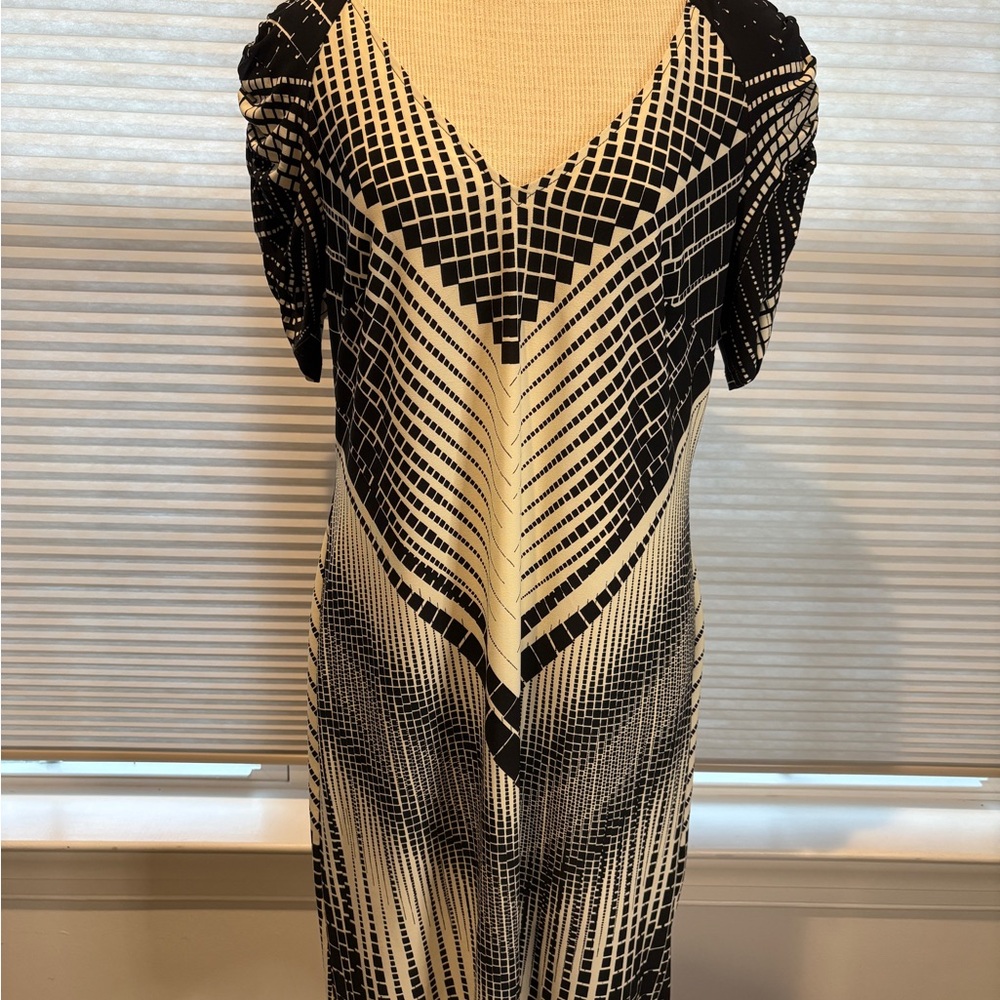 Easy care dress with strategic flattering design